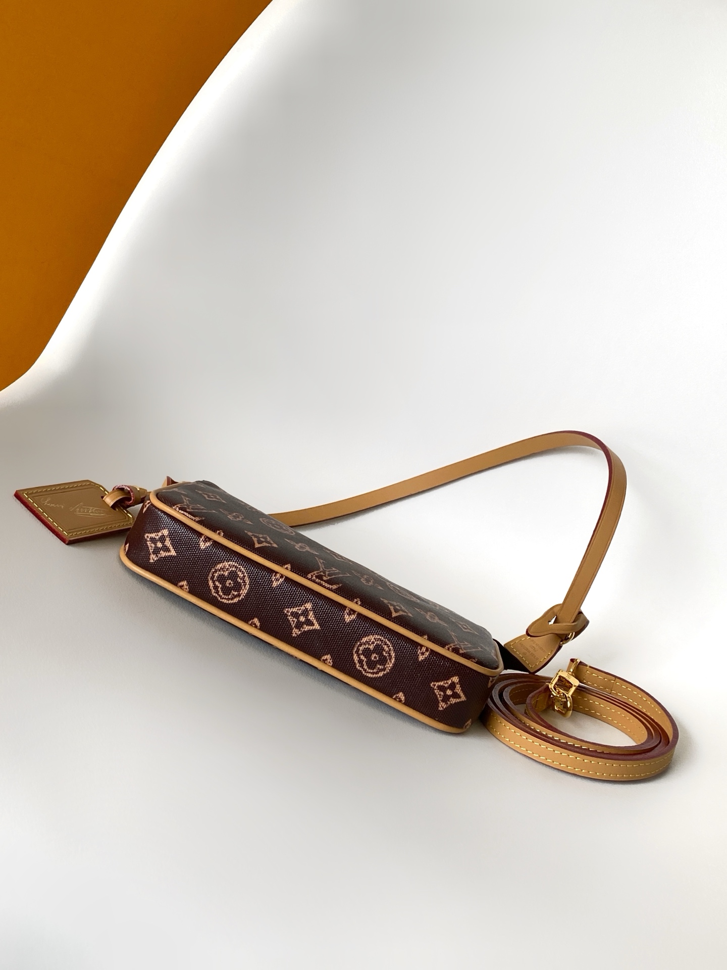 Louis Vuitton This Pochette Accessoires handbag is specially designed to celebrate the birth of the Louis Vuitton Monogram pattern.