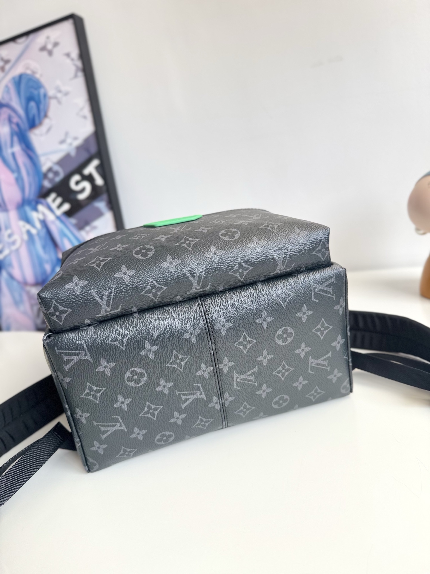 Louis Vuitton This small Discovery backpack features a patchwork of Monogram Eclipse canvas and vibrant cowhide leather.