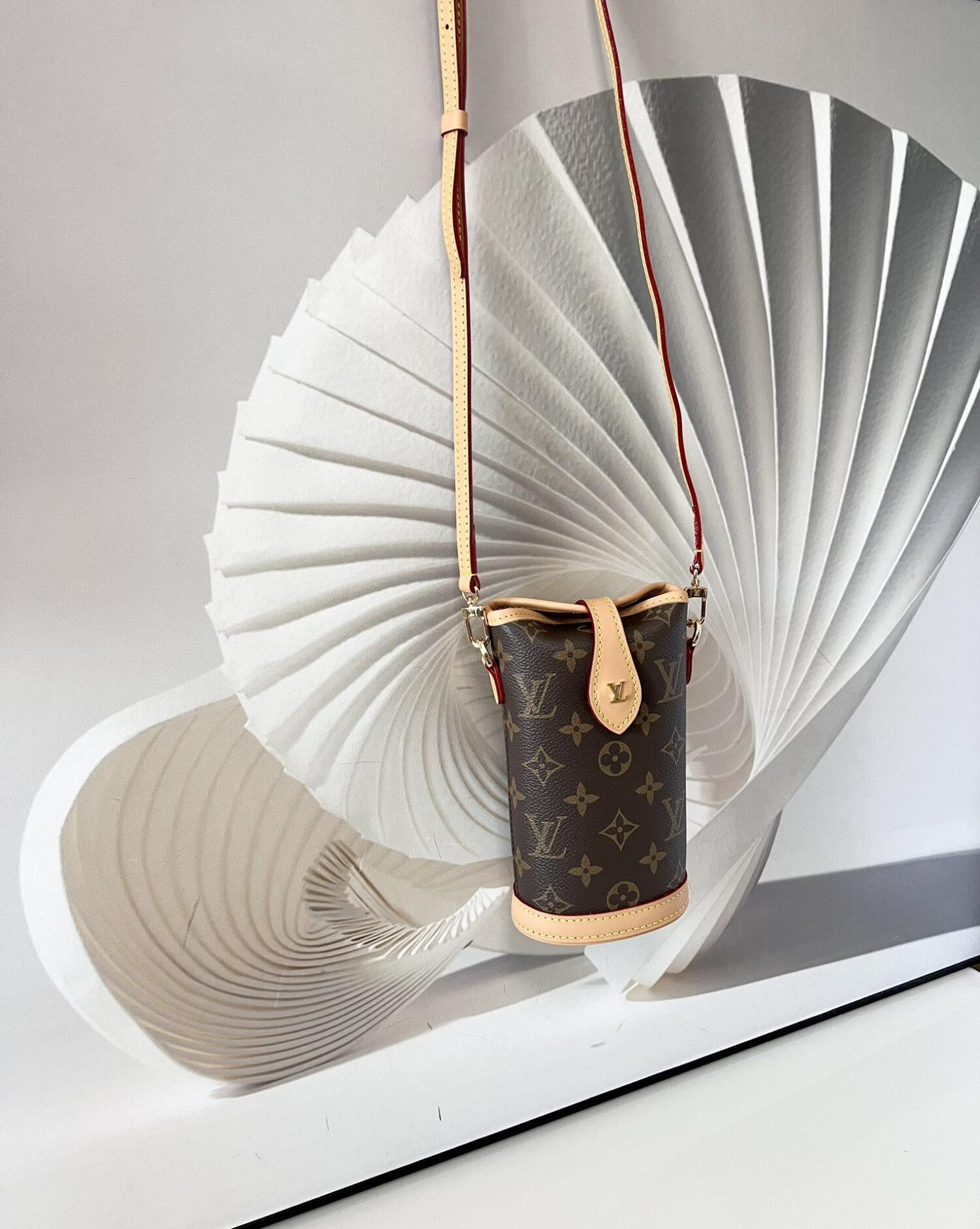 Louis Vuitton Mini Ice Cream Cone Bag — New "Fold Me" Mini Model, featuring a magnetic button closure design.