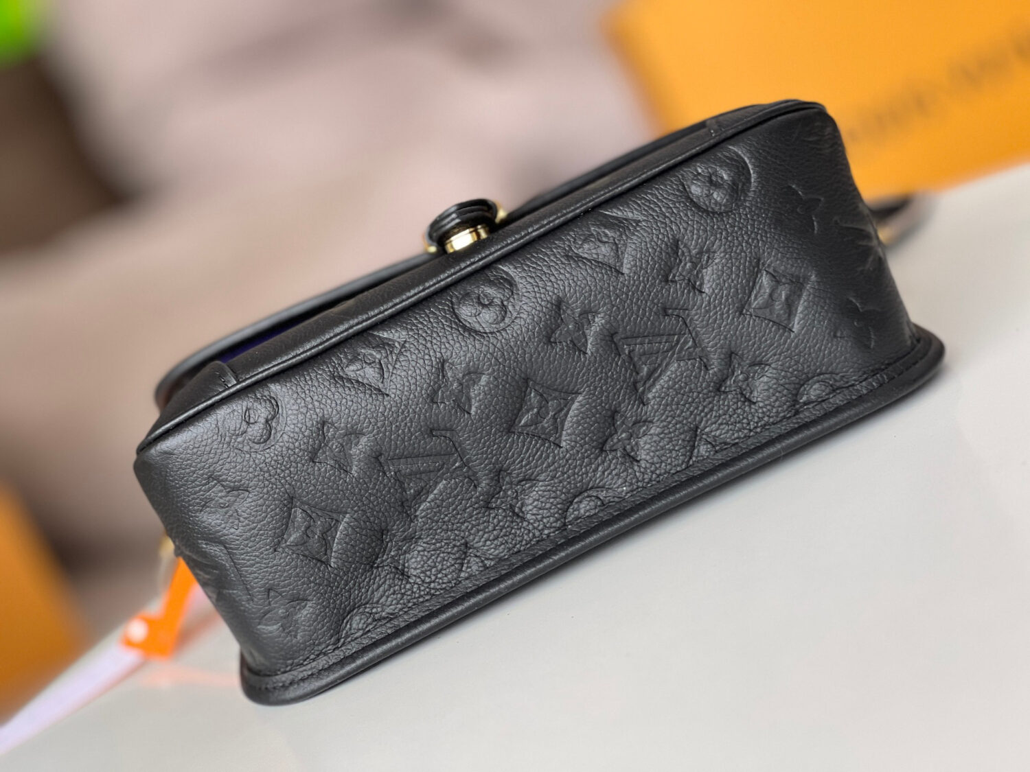 Louis Vuitton This Diane handbag is crafted from Louis Vuitton's classic Monogram Empreinte embossed leather.