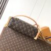 Louis Vuitton This large Side Trunk handbag features Monogram canvas accented with contrasting leather trim.