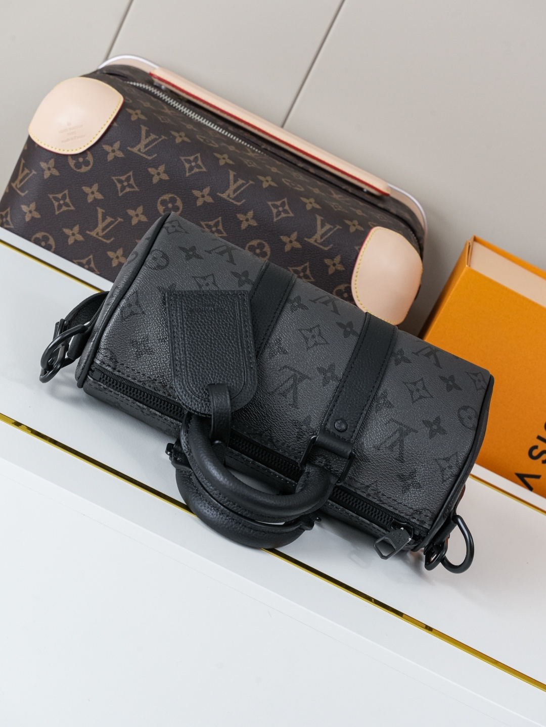 Louis Vuitton This Keell Bandoulière 25 handbag features Monogram Midnight coated canvas accented with a deep Monogram print.