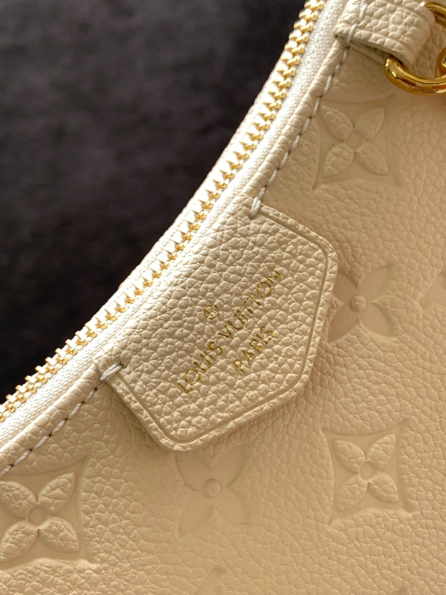 Louis Vuitton The Easy Pouch On Strap handbag from the Spring 2022 Collection is crafted from Monogram Empreinte leather.