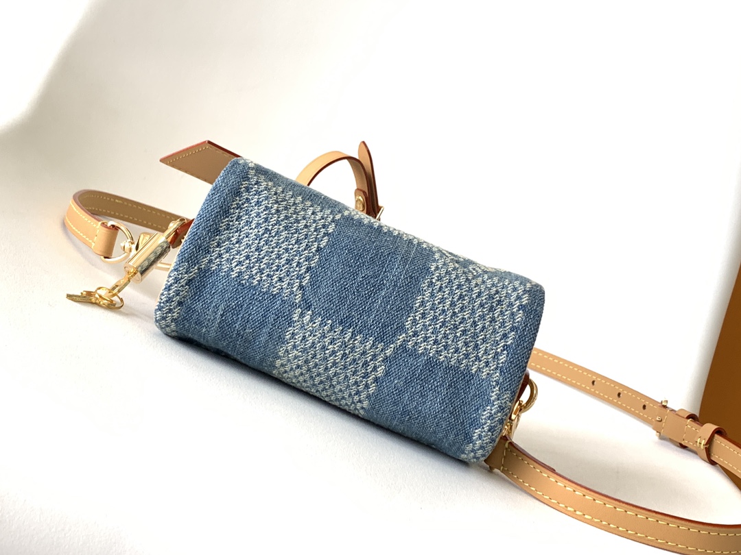 Louis Vuitton N40682 — FW New Denim Collection. The Sunset bag takes center stage in Monogram Denim canvas.