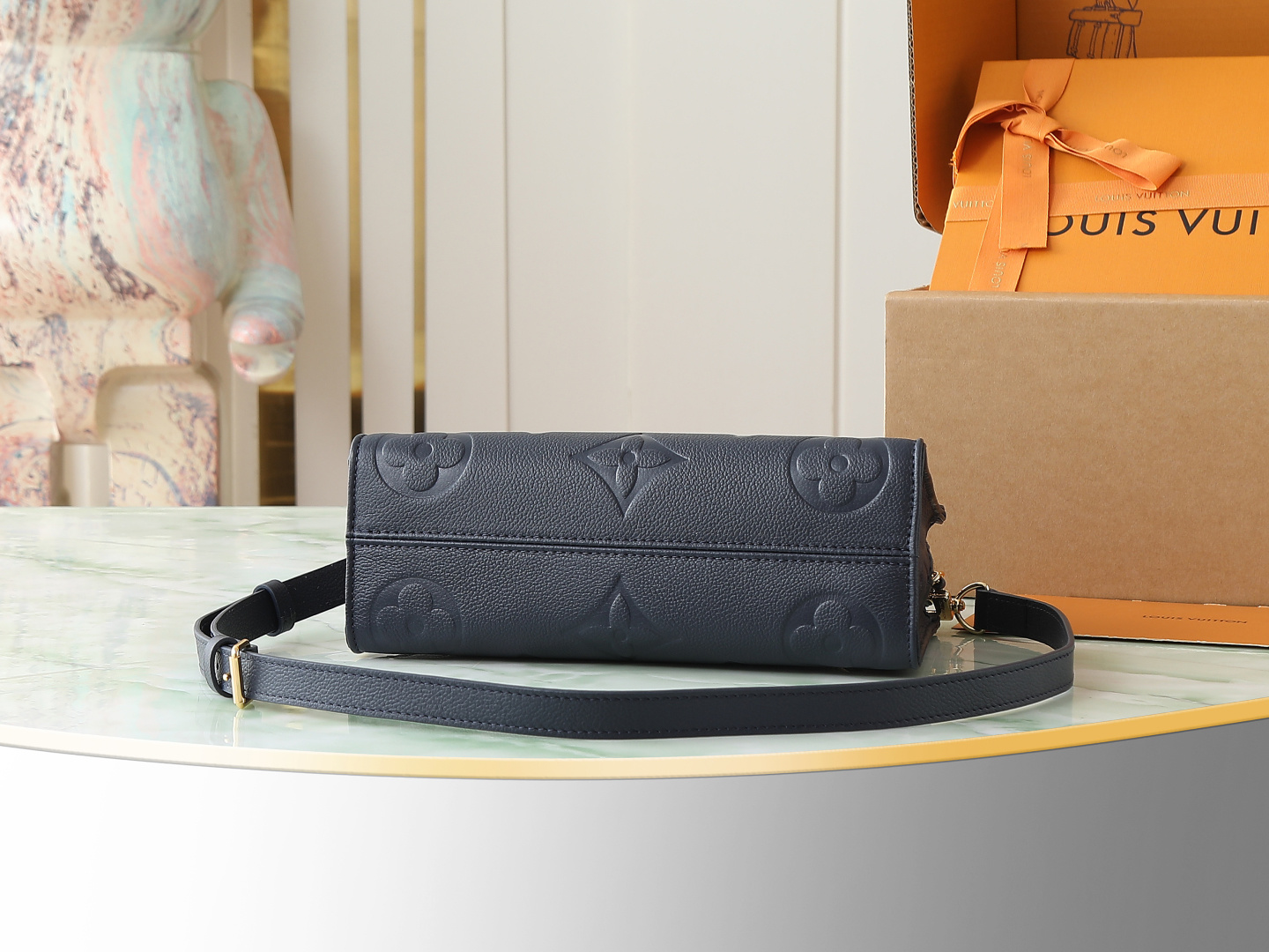 Louis Vuitton M23640 Deep Blue Embossed: This small OnTheGo handbag is crafted from Monogram Empreinte leather, embossed with the Giant Monogram pattern.