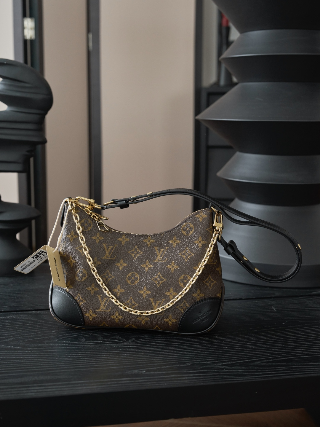 Louis Vuitton Crafted from classic Monogram canvas, this small Boulogne handbag features a double-zip closure and a spacious interior flat pocket large enough to accommodate a smartphone.