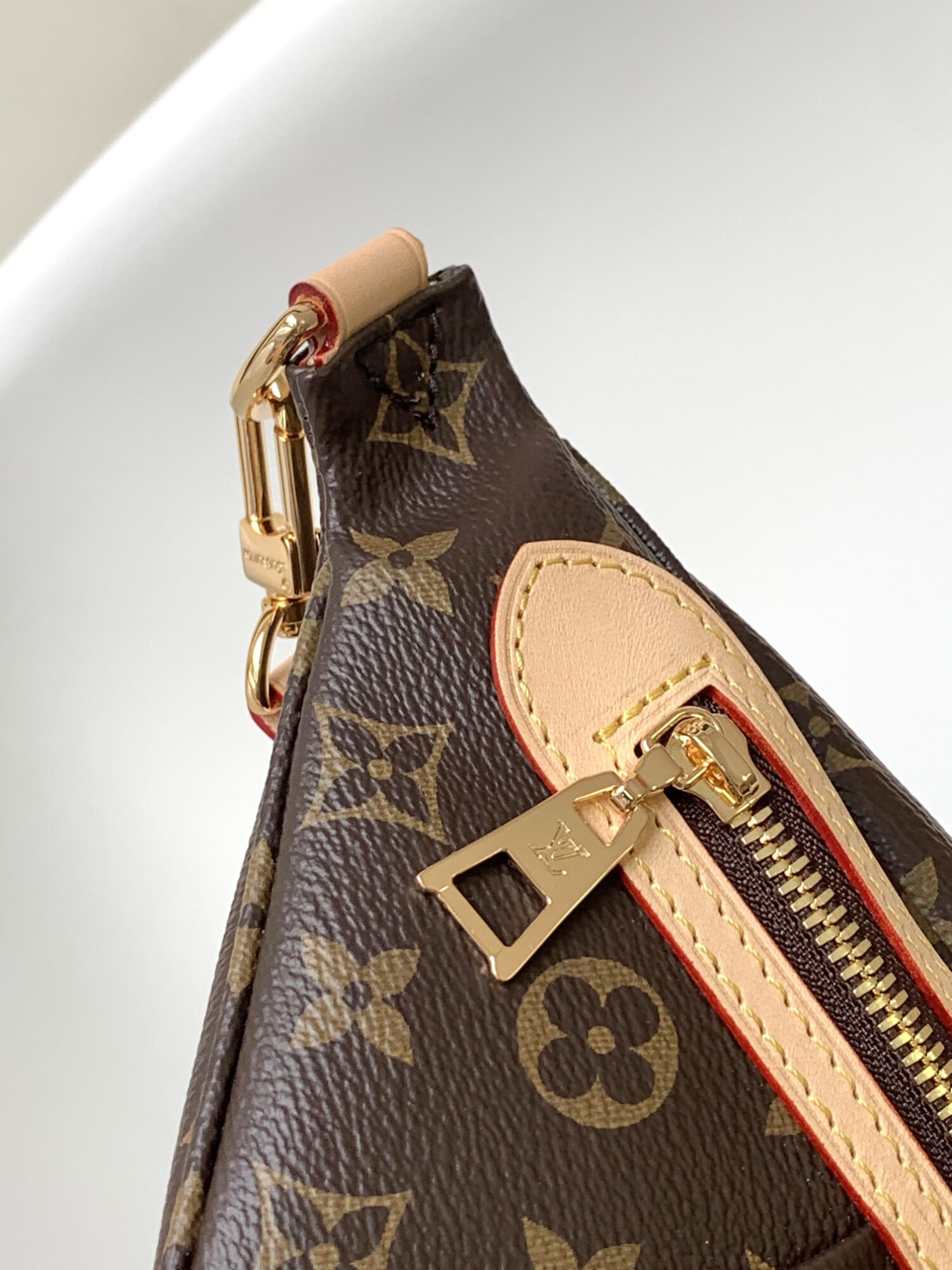 Louis Vuitton The M46784 High-Rise Bag is crafted from Montaigne-coated canvas.