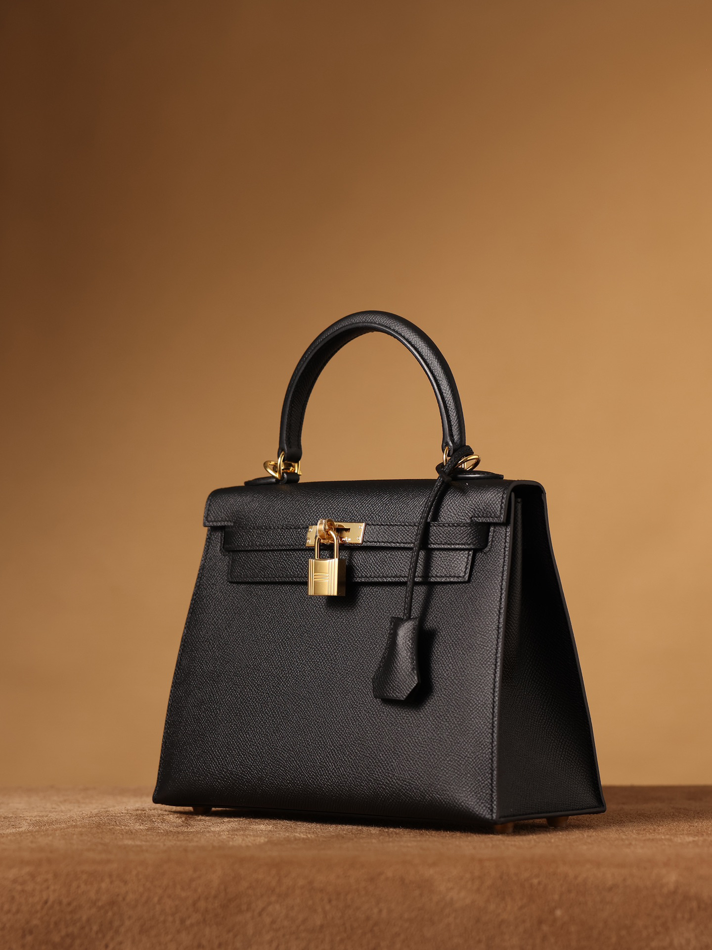 Hermes Kelly bag, black, 25cm, with gold hardware.