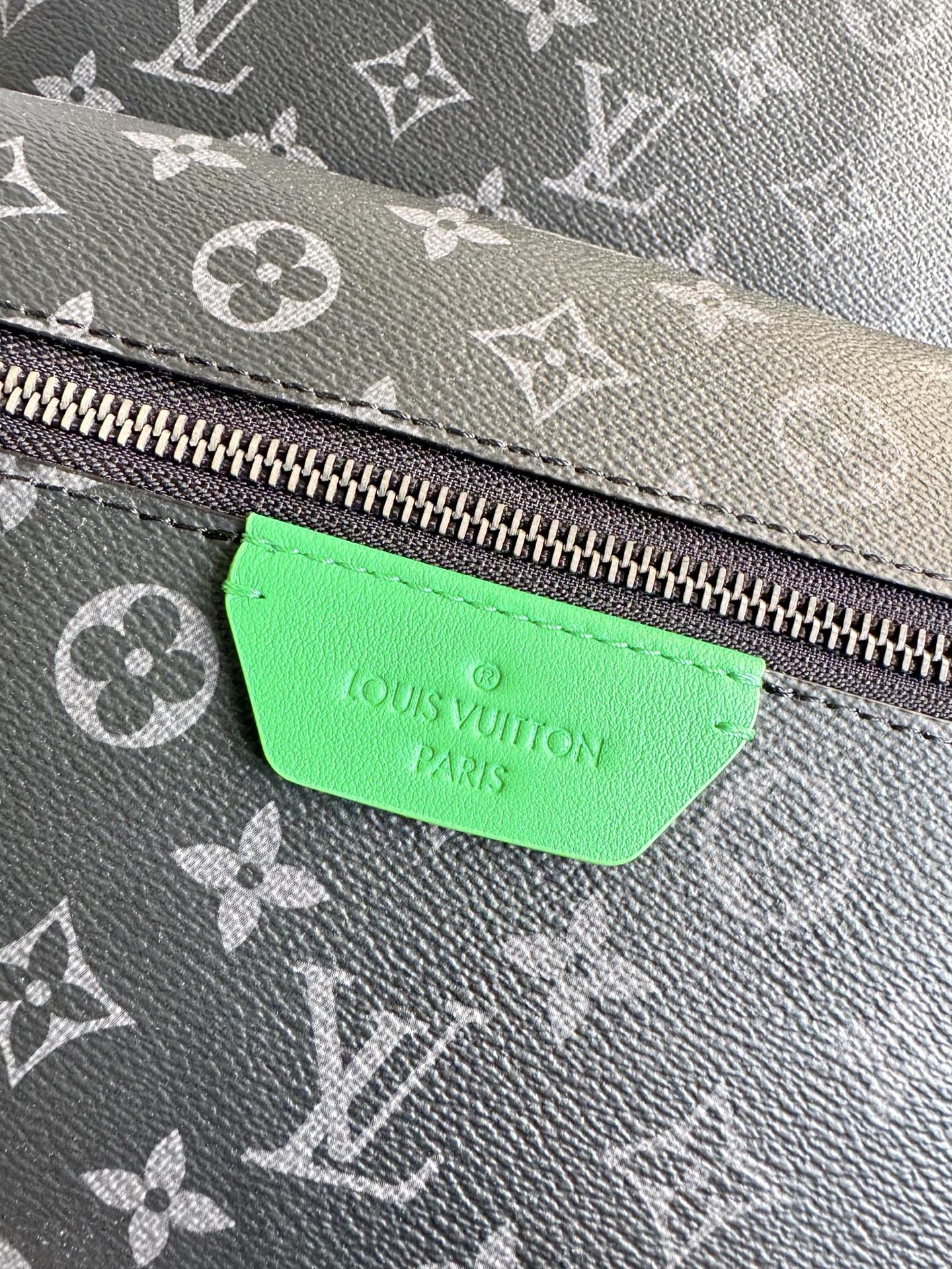 Louis Vuitton This small Discovery backpack features a patchwork of Monogram Eclipse canvas and vibrant cowhide leather.