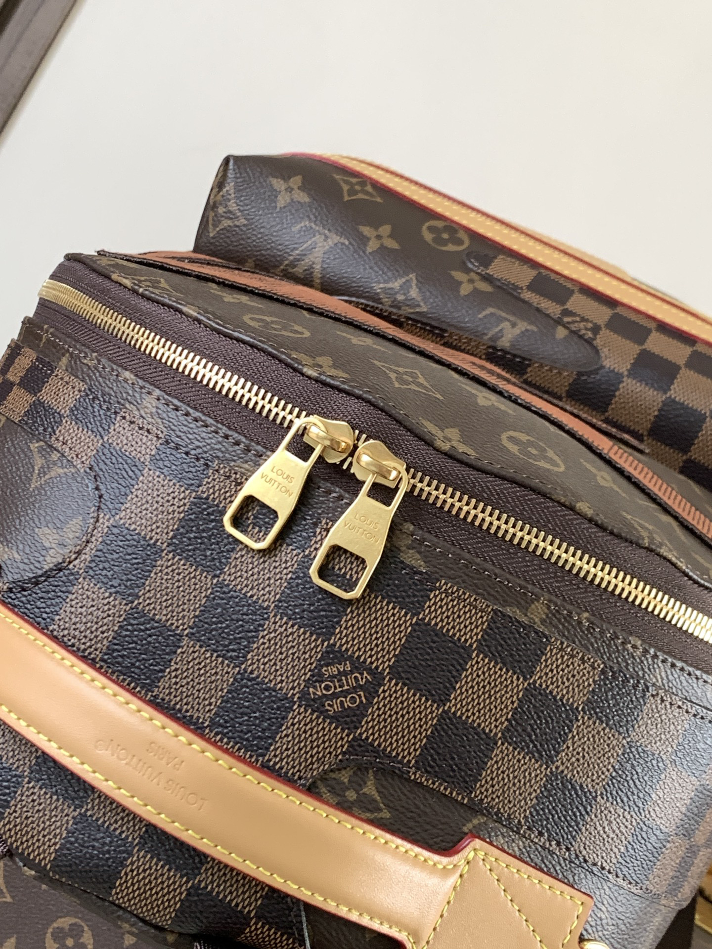 Louis Vuitton This Discovery Small Backpack features Monogram canvas accented with Monogram Reverse and Damier canvas patches.