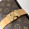 Louis Vuitton This Pochette Mia handbag, part of the Monogram collection, features a Monogram canvas body accented with cowhide leather trim.