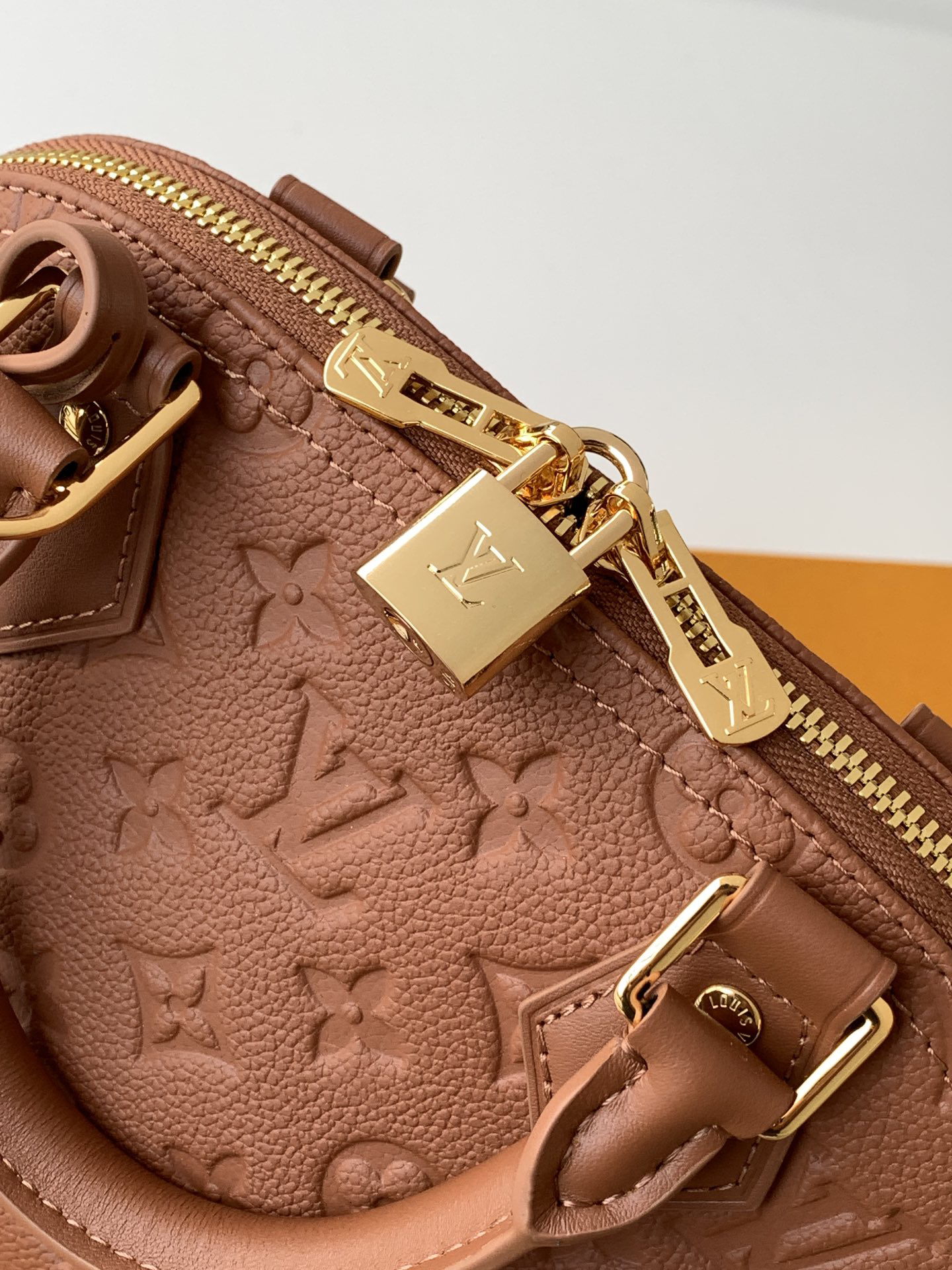 Louis Vuitton This Alma BB handbag showcases the iconic Alma BB silhouette, crafted from the House's exceptionally soft Monogram Empreinte leather.
