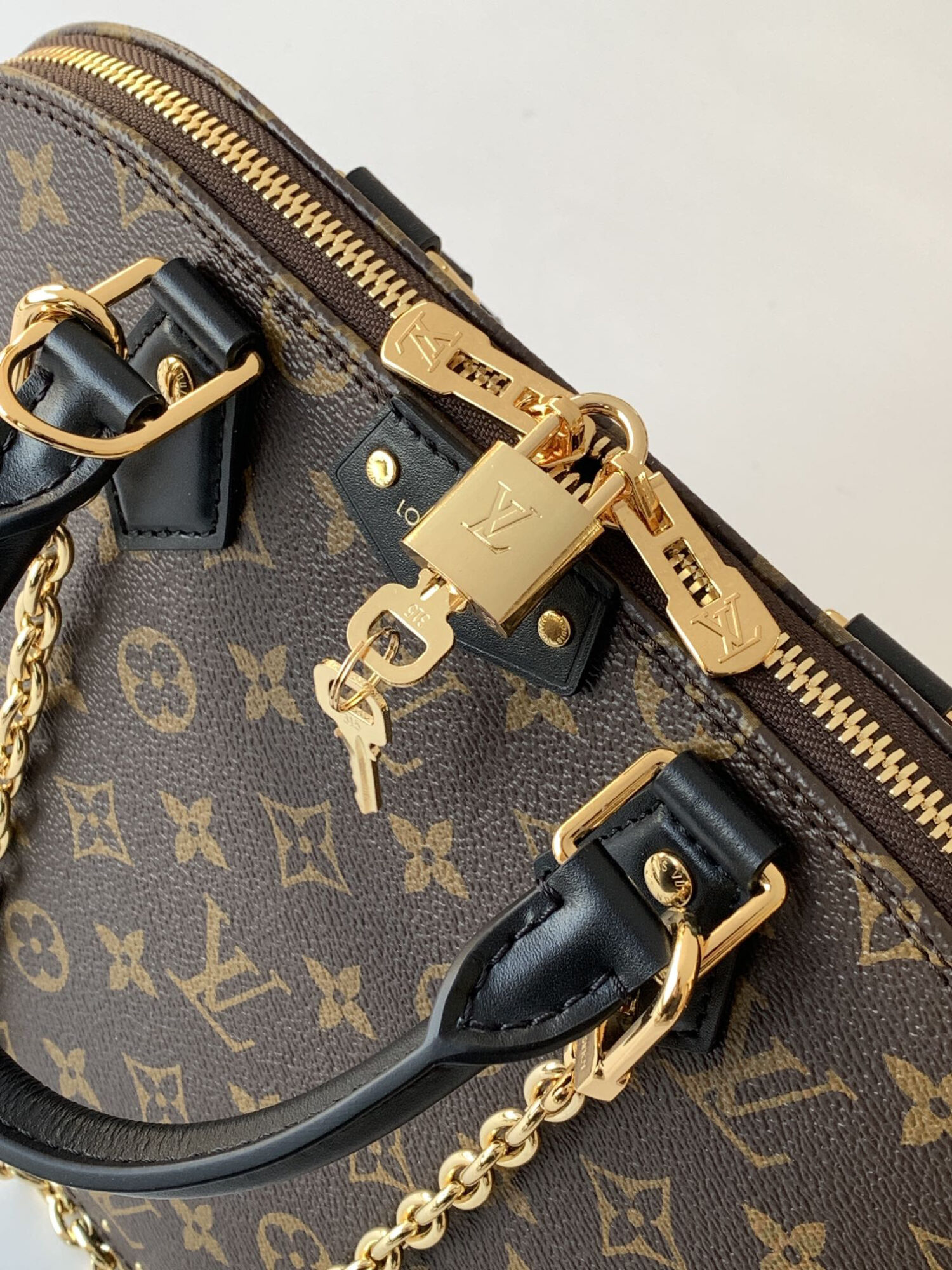Louis Vuitton The Trunk collection welcomes a contemporary new iteration of the Alma Small handbag, paying homage to the brand's travel heritage with exquisite metal hardware.