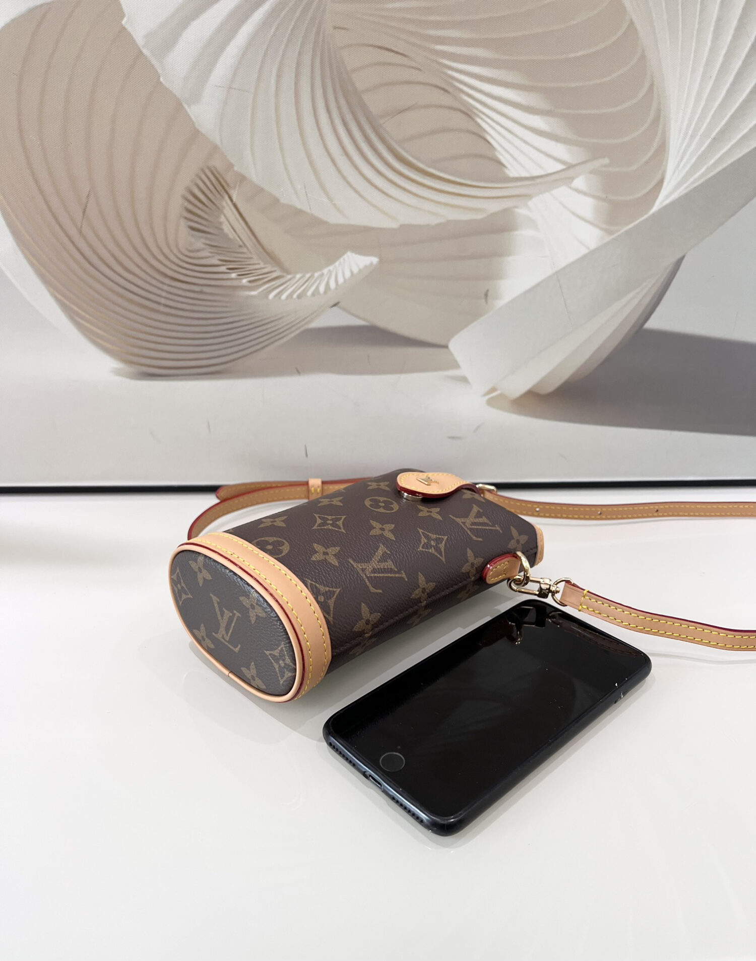 Louis Vuitton Mini Ice Cream Cone Bag — New "Fold Me" Mini Model, featuring a magnetic button closure design.