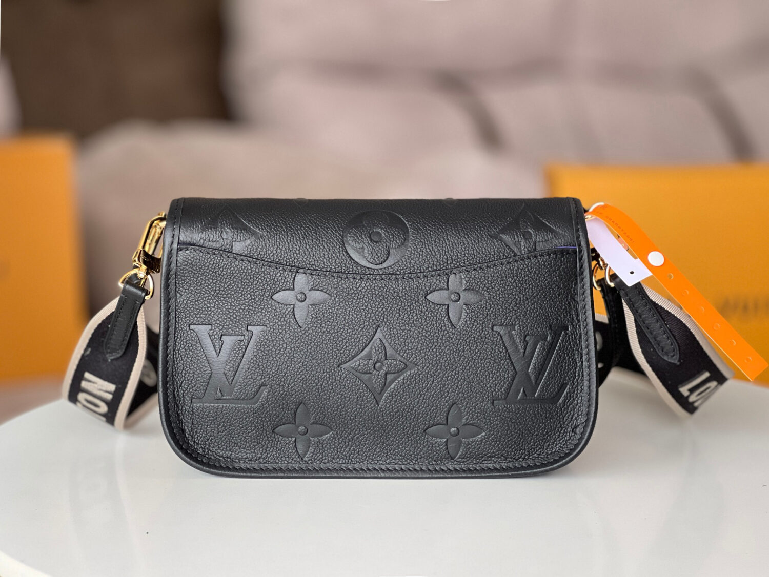 Louis Vuitton This Diane handbag is crafted from Louis Vuitton's classic Monogram Empreinte embossed leather.