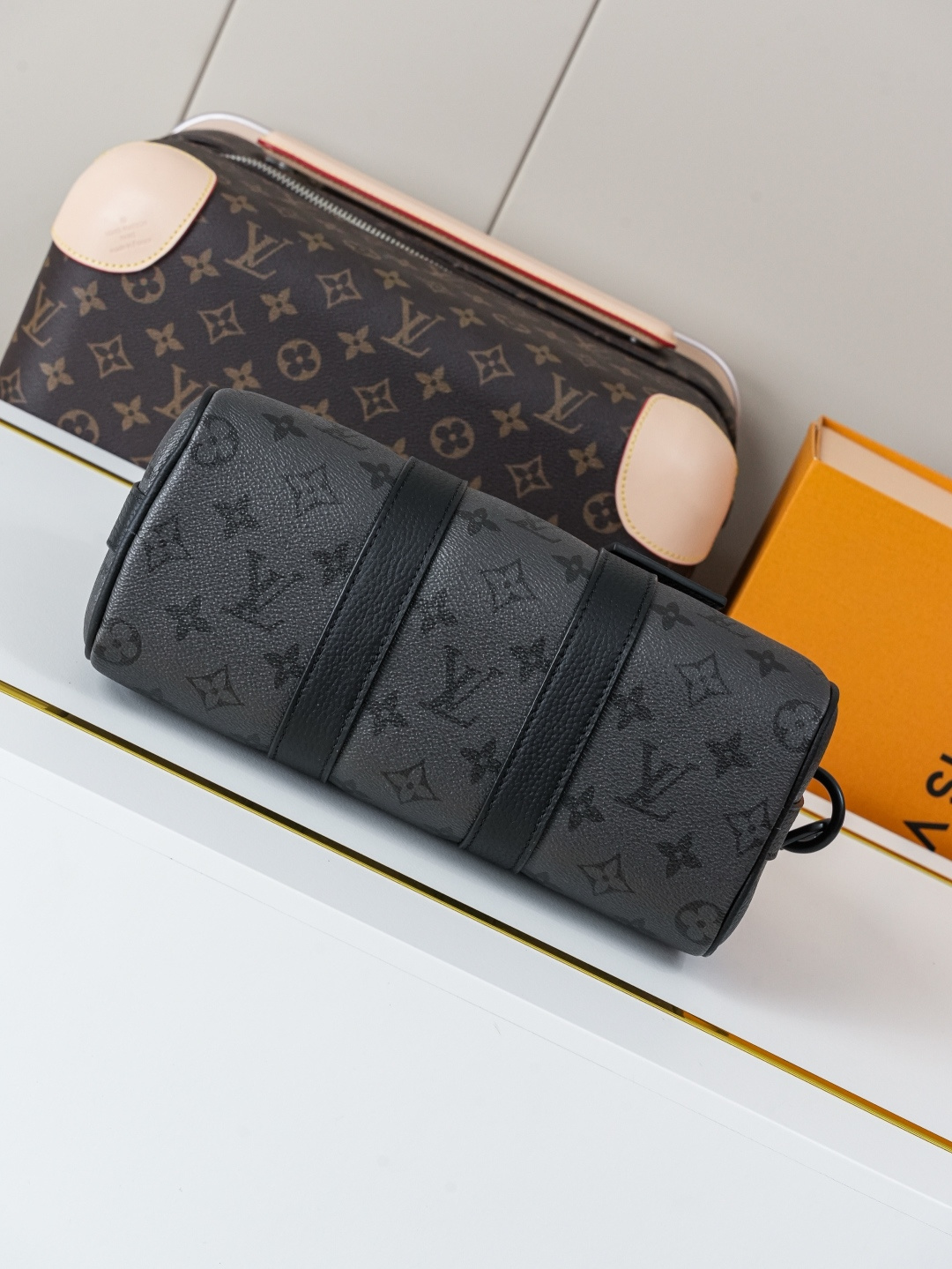 Louis Vuitton This Keell Bandoulière 25 handbag features Monogram Midnight coated canvas accented with a deep Monogram print.