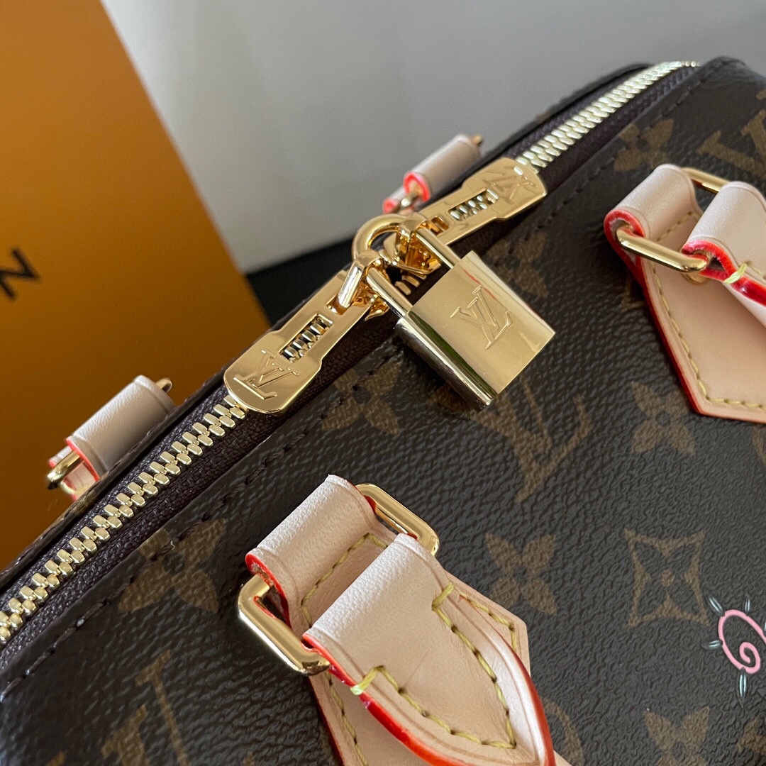Louis Vuitton This Speedy Bandoulière 20 handbag combines Monogram canvas with cowhide leather trim.