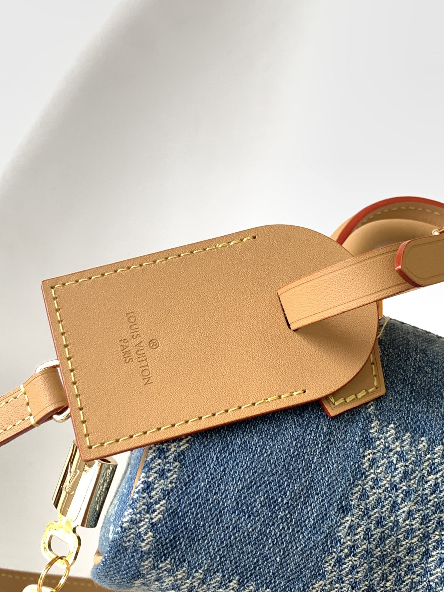 Louis Vuitton N40682 — FW New Denim Collection. The Sunset bag takes center stage in Monogram Denim canvas.