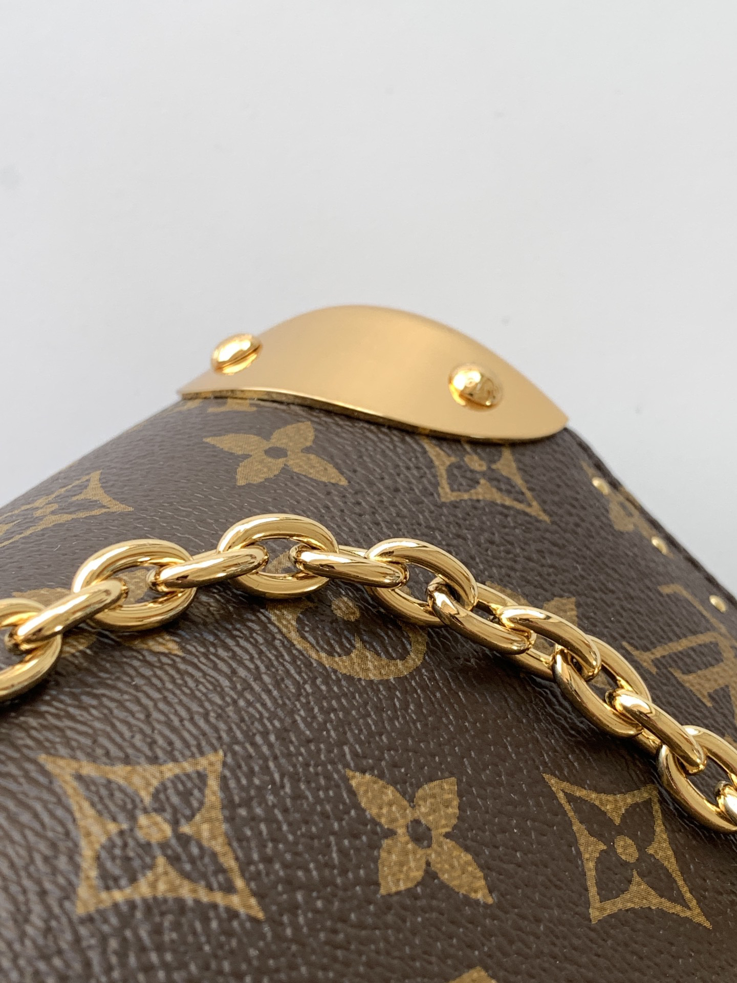Louis Vuitton The Trunk collection welcomes a contemporary new iteration of the Alma Small handbag, paying homage to the brand's travel heritage with exquisite metal hardware.