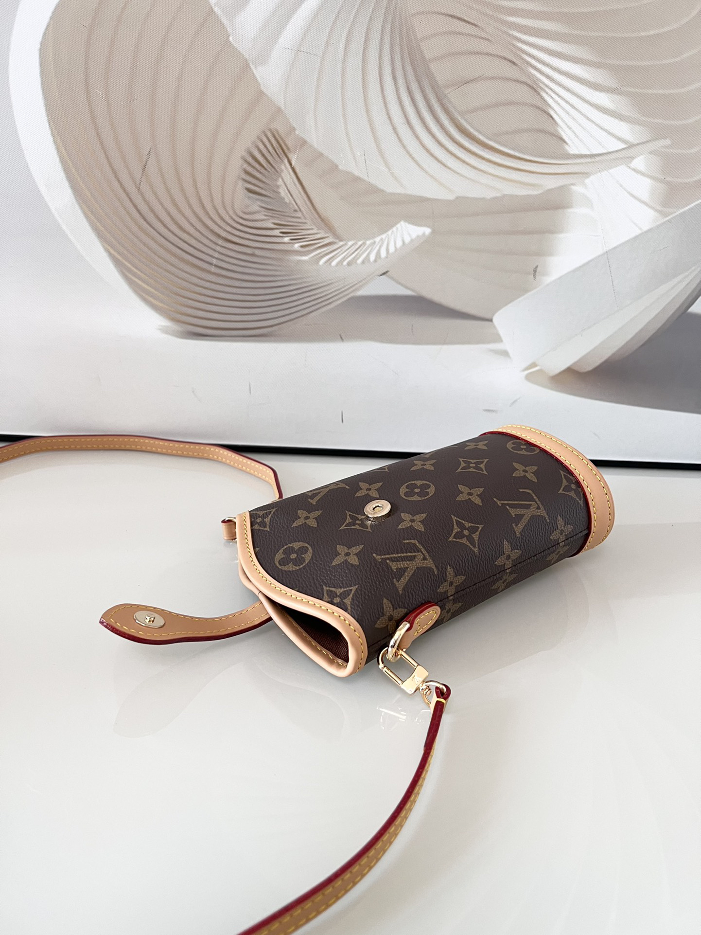 Louis Vuitton Mini Ice Cream Cone Bag — New "Fold Me" Mini Model, featuring a magnetic button closure design.