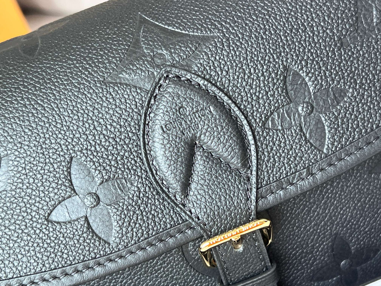 Louis Vuitton This Diane handbag is crafted from Louis Vuitton's classic Monogram Empreinte embossed leather.