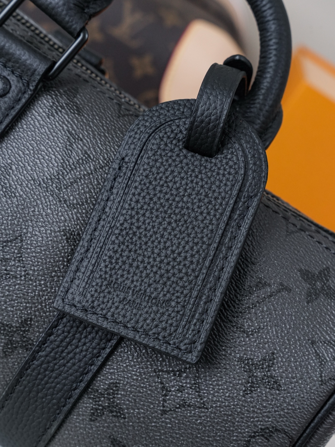Louis Vuitton This Keell Bandoulière 25 handbag features Monogram Midnight coated canvas accented with a deep Monogram print.