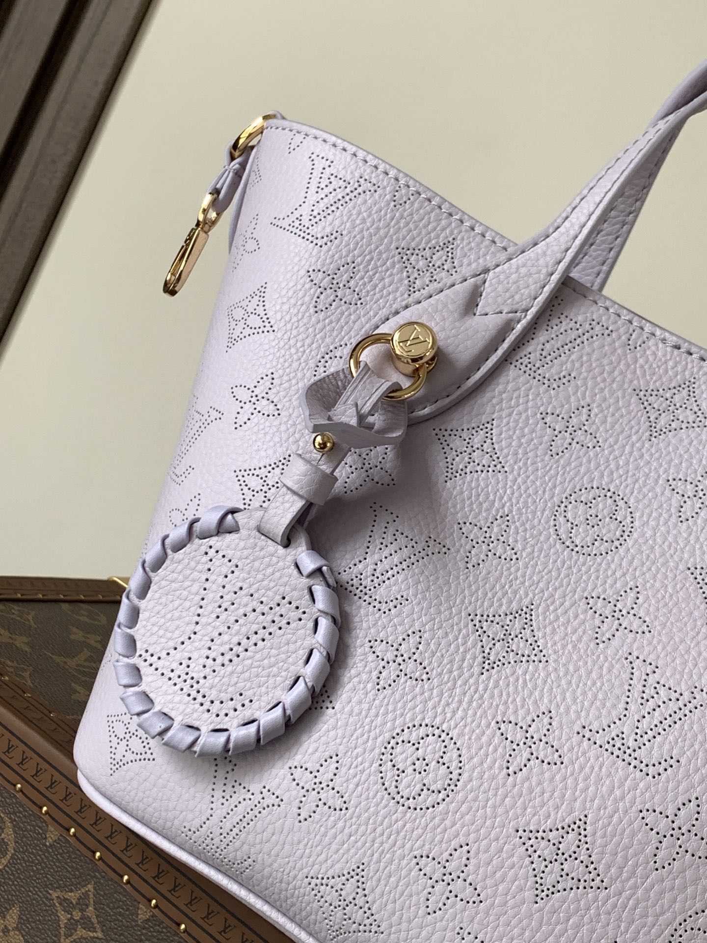 Louis Vuitton This small Blossom handbag is steeped in the modern hues of the new season.