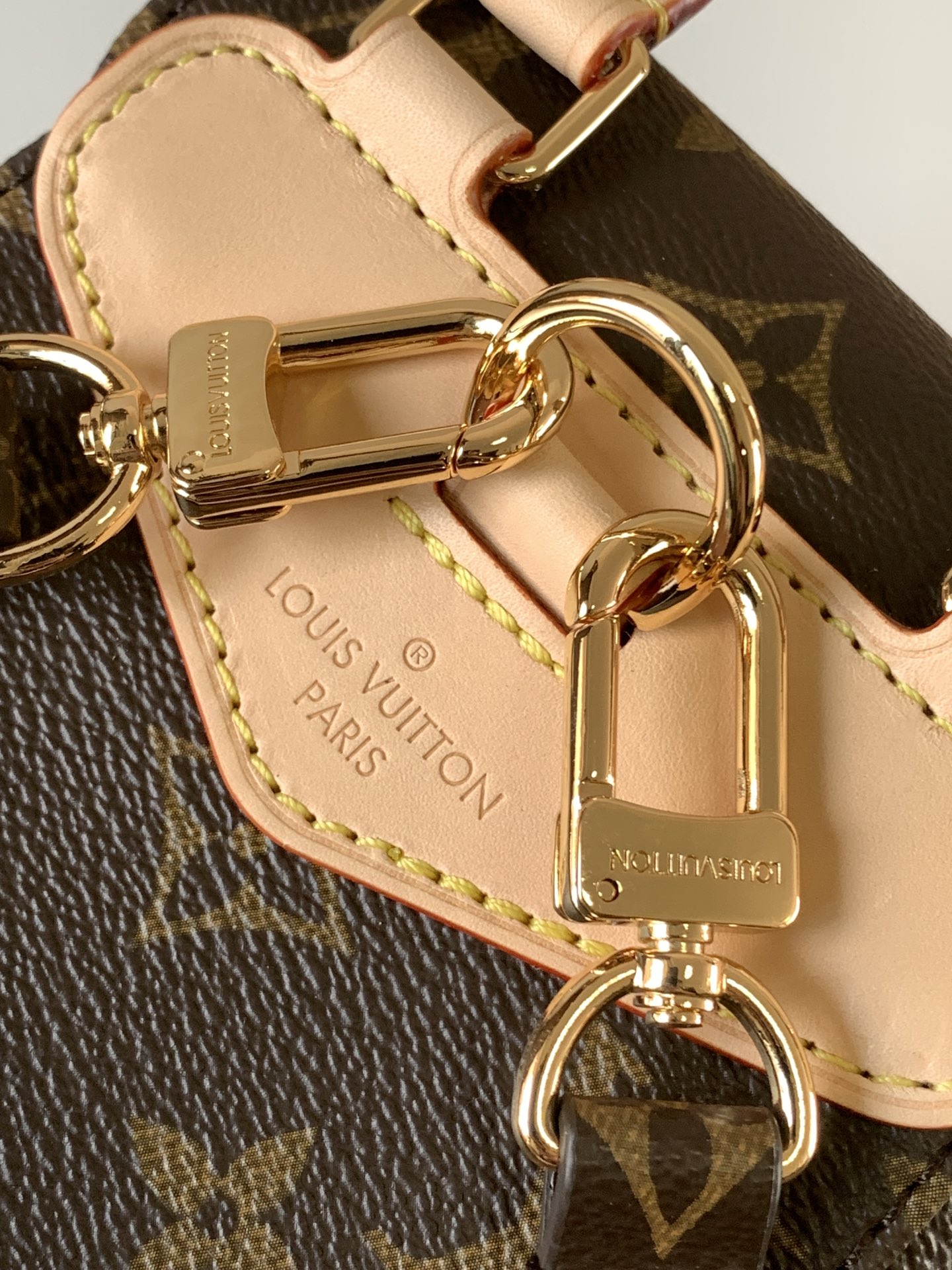 Louis Vuitton This Montsouris Mini features Monogram coated canvas with cowhide leather trim.