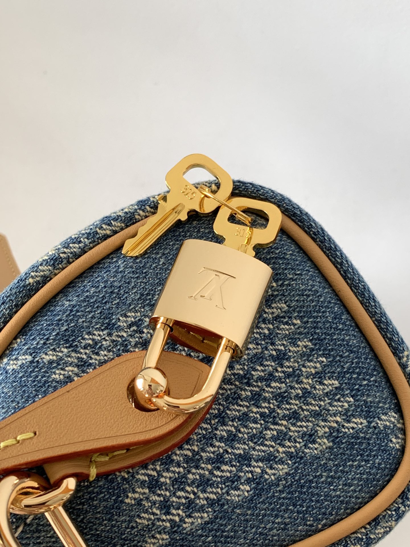 Louis Vuitton N40682 — FW New Denim Collection. The Sunset bag takes center stage in Monogram Denim canvas.