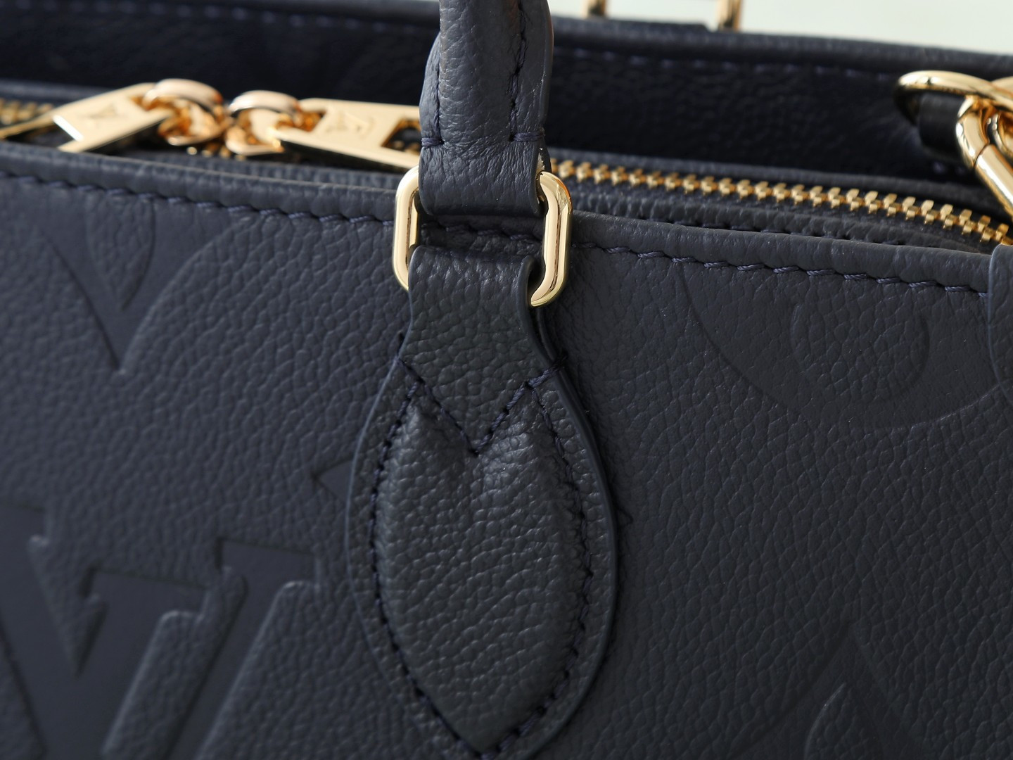 Louis Vuitton M23640 Deep Blue Embossed: This small OnTheGo handbag is crafted from Monogram Empreinte leather, embossed with the Giant Monogram pattern.