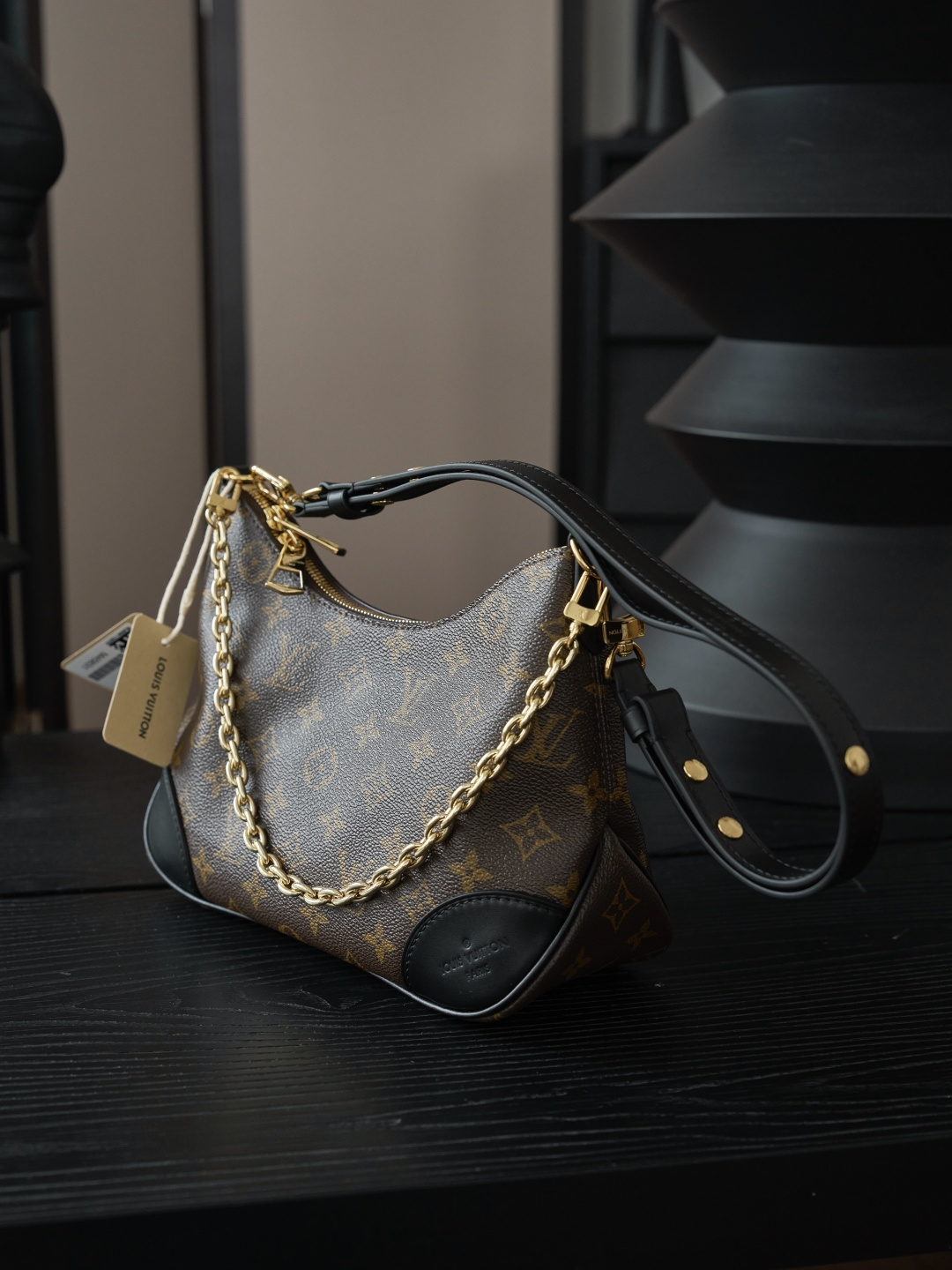 Louis Vuitton Crafted from classic Monogram canvas, this small Boulogne handbag features a double-zip closure and a spacious interior flat pocket large enough to accommodate a smartphone.