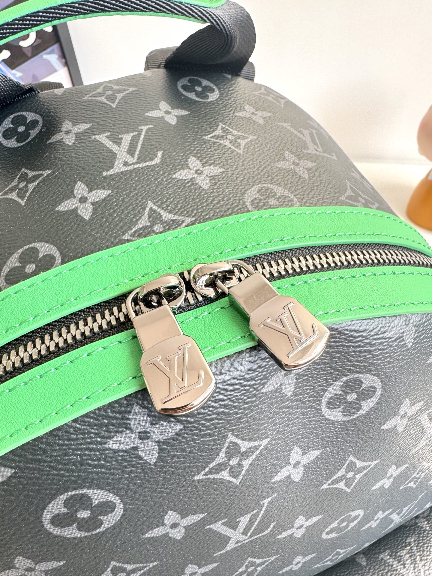 Louis Vuitton This small Discovery backpack features a patchwork of Monogram Eclipse canvas and vibrant cowhide leather.