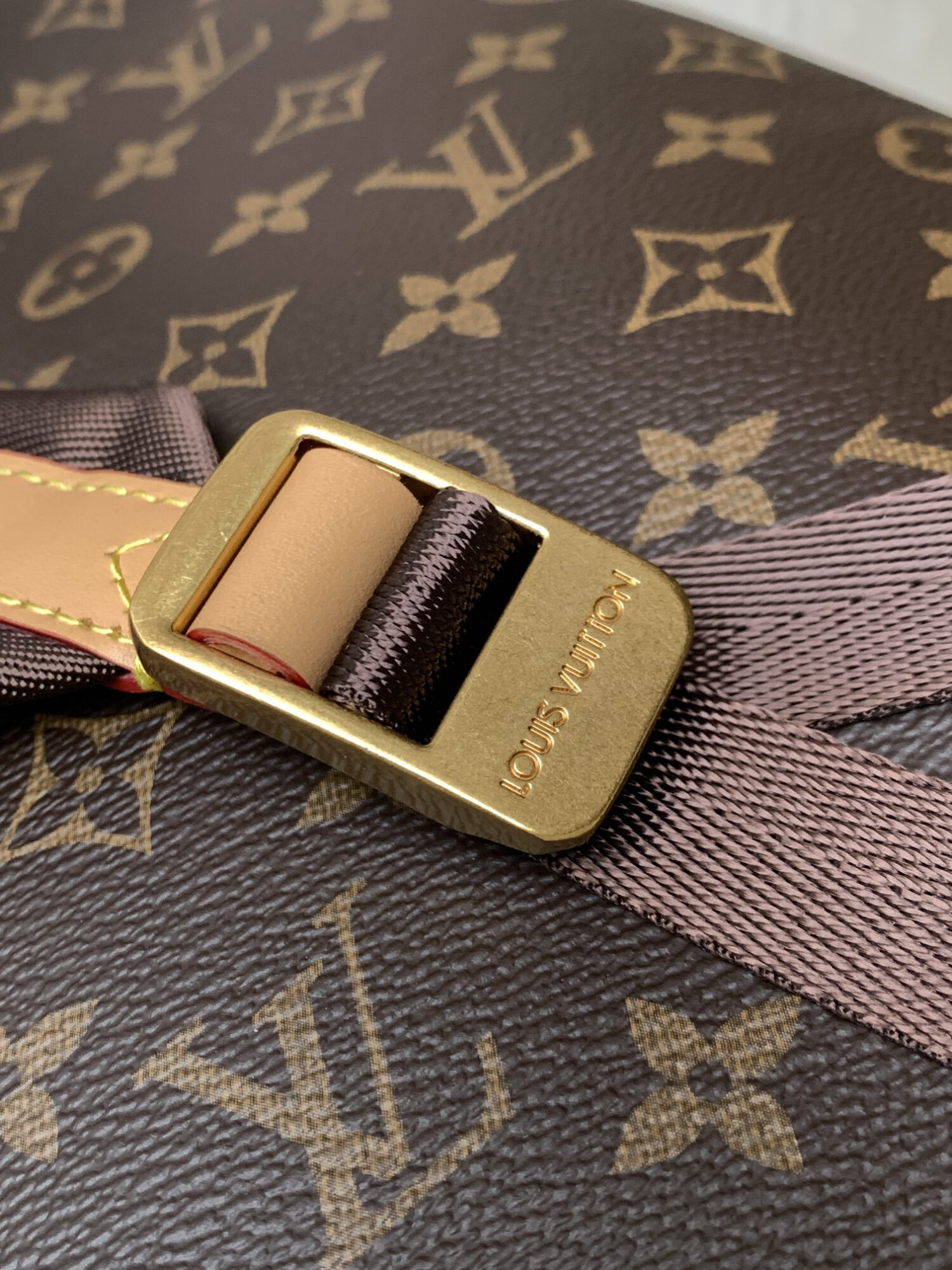 Louis Vuitton This Discovery Small Backpack features Monogram canvas accented with Monogram Reverse and Damier canvas patches.