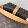 Louis Vuitton This Pochette Mia handbag, part of the Monogram collection, features a Monogram canvas body accented with cowhide leather trim.