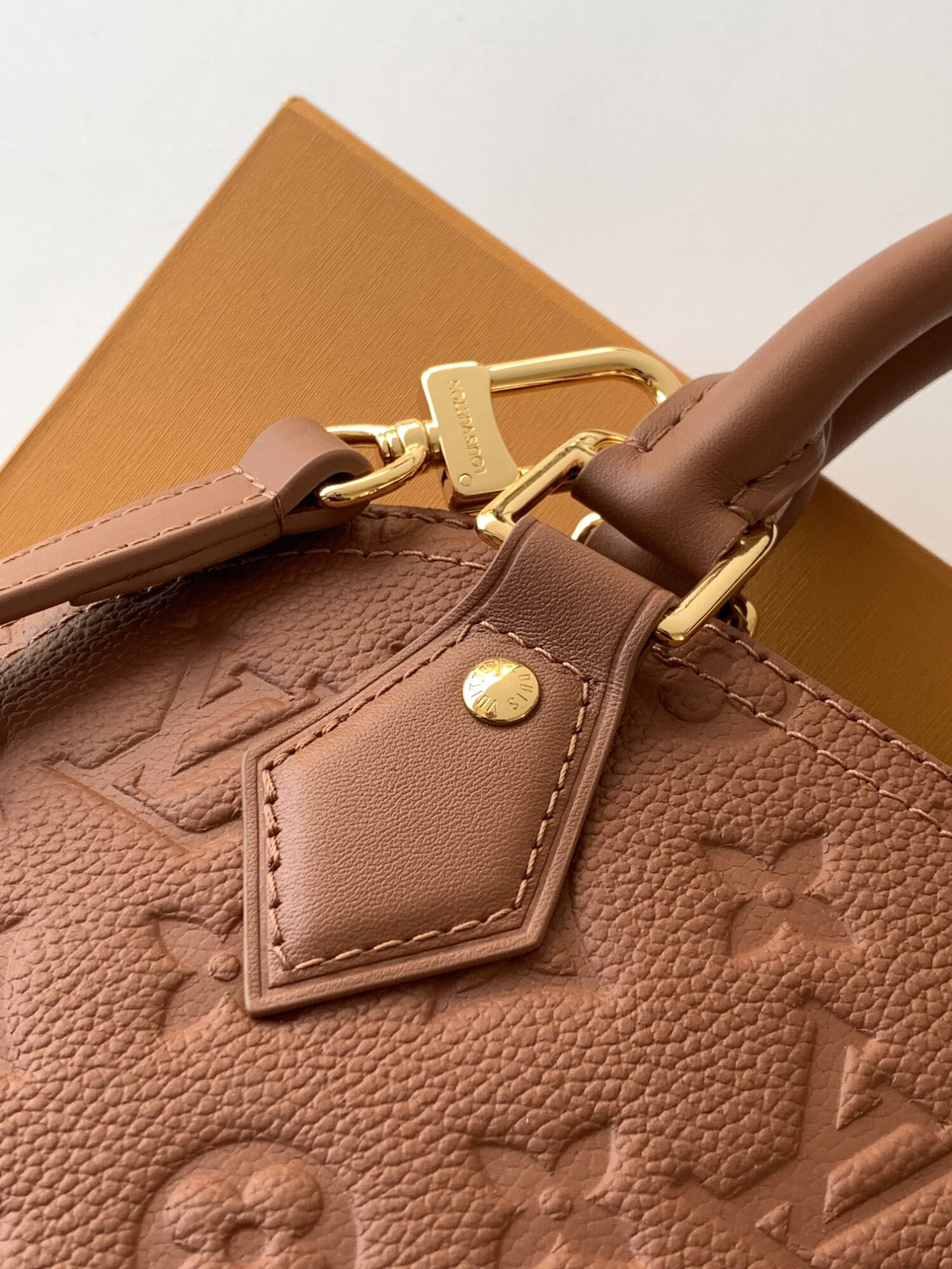 Louis Vuitton This Alma BB handbag showcases the iconic Alma BB silhouette, crafted from the House's exceptionally soft Monogram Empreinte leather.