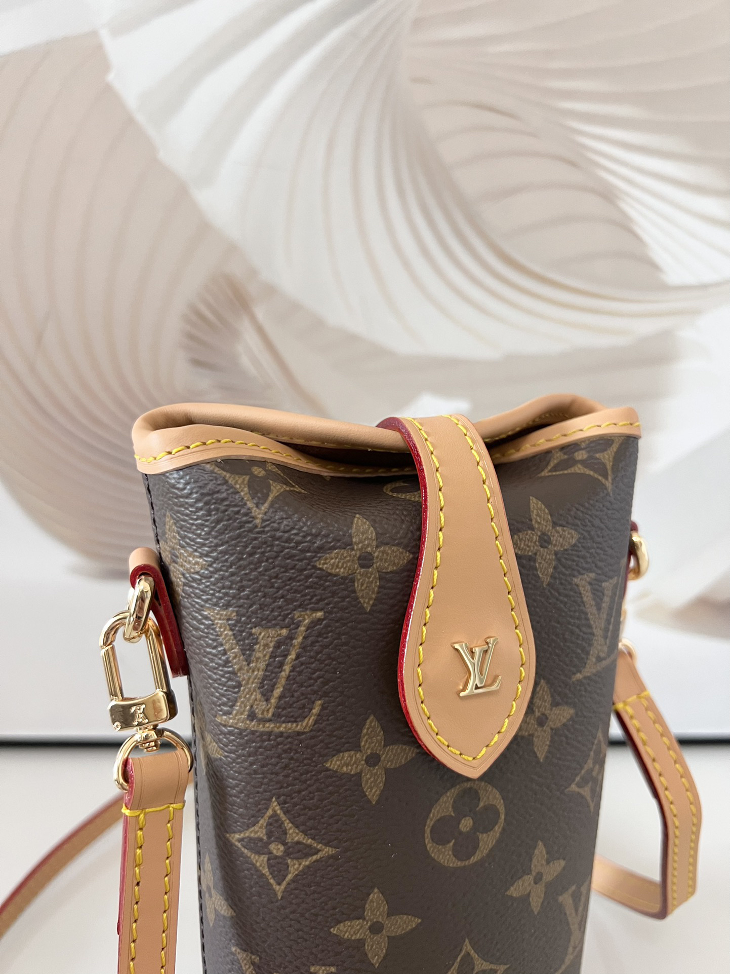Louis Vuitton Mini Ice Cream Cone Bag — New "Fold Me" Mini Model, featuring a magnetic button closure design.