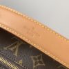 Louis Vuitton This large Side Trunk handbag features Monogram canvas accented with contrasting leather trim.