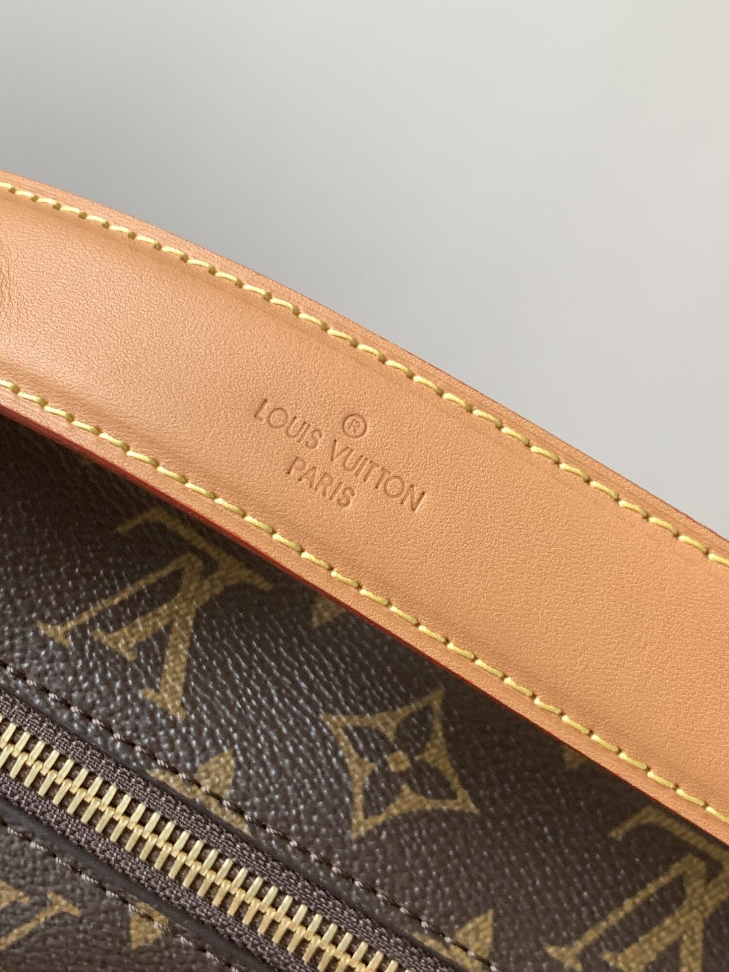 Louis Vuitton This large Side Trunk handbag features Monogram canvas accented with contrasting leather trim.