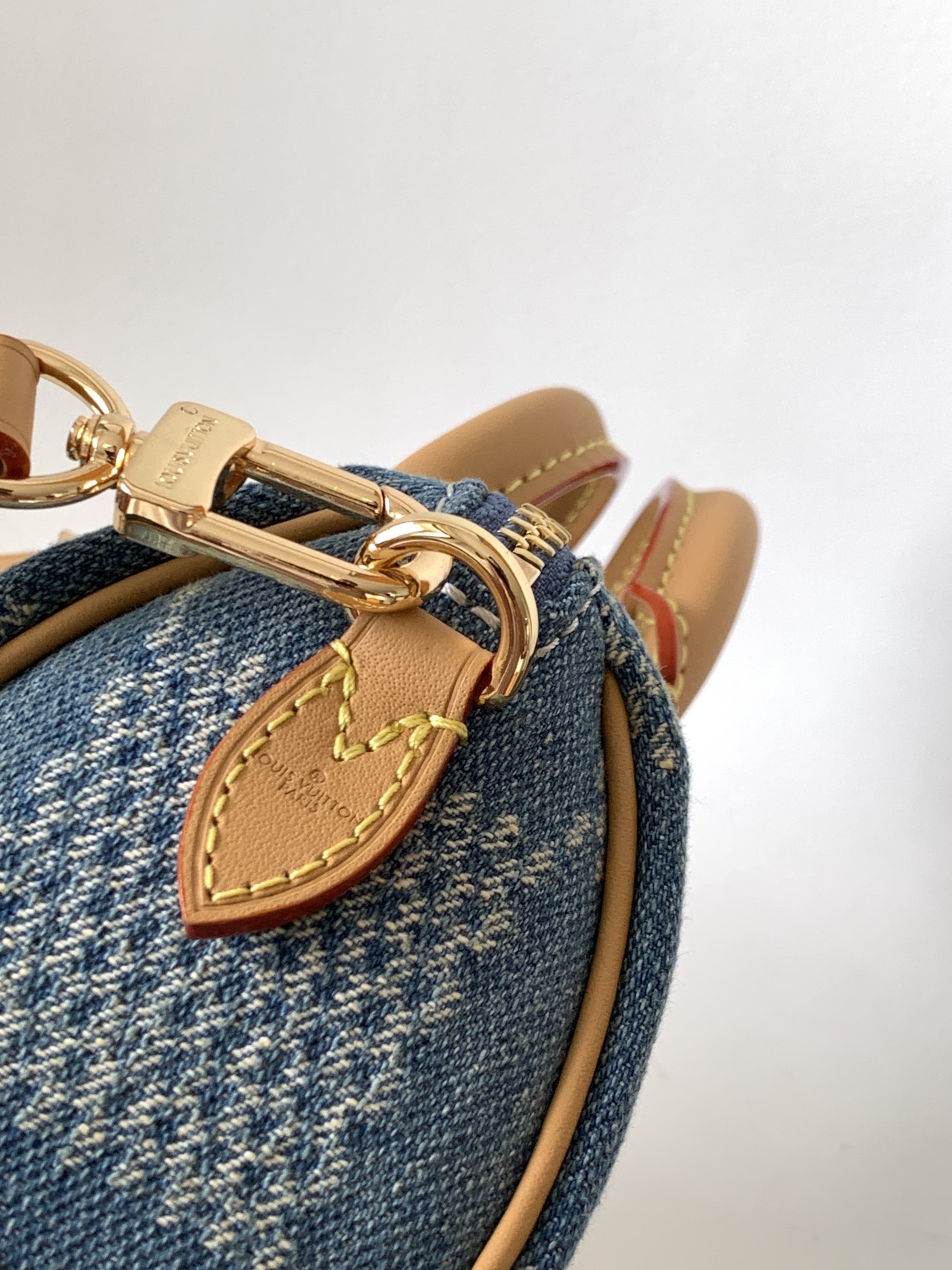 Louis Vuitton N40682 — FW New Denim Collection. The Sunset bag takes center stage in Monogram Denim canvas.