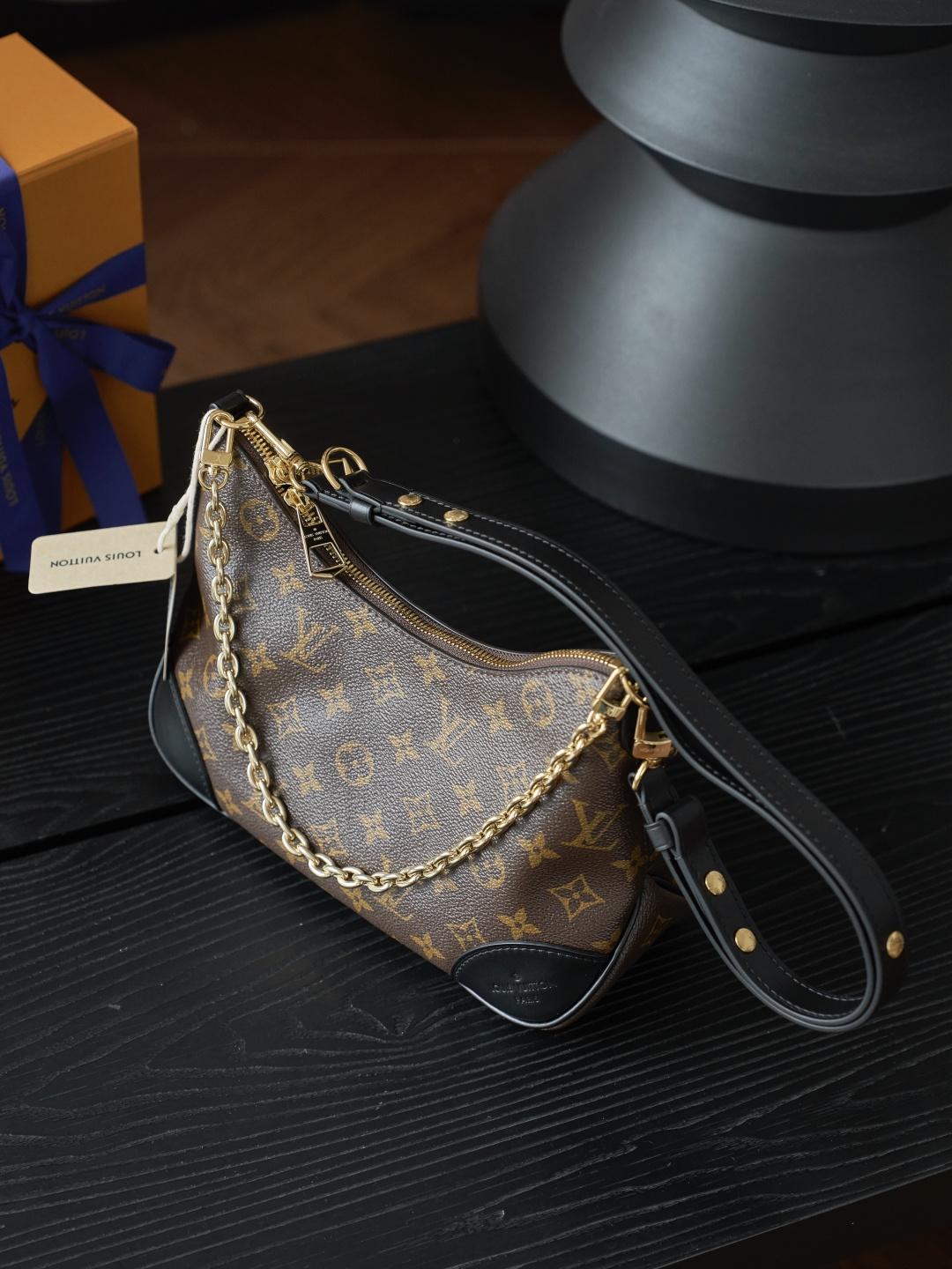 Louis Vuitton Crafted from classic Monogram canvas, this small Boulogne handbag features a double-zip closure and a spacious interior flat pocket large enough to accommodate a smartphone.