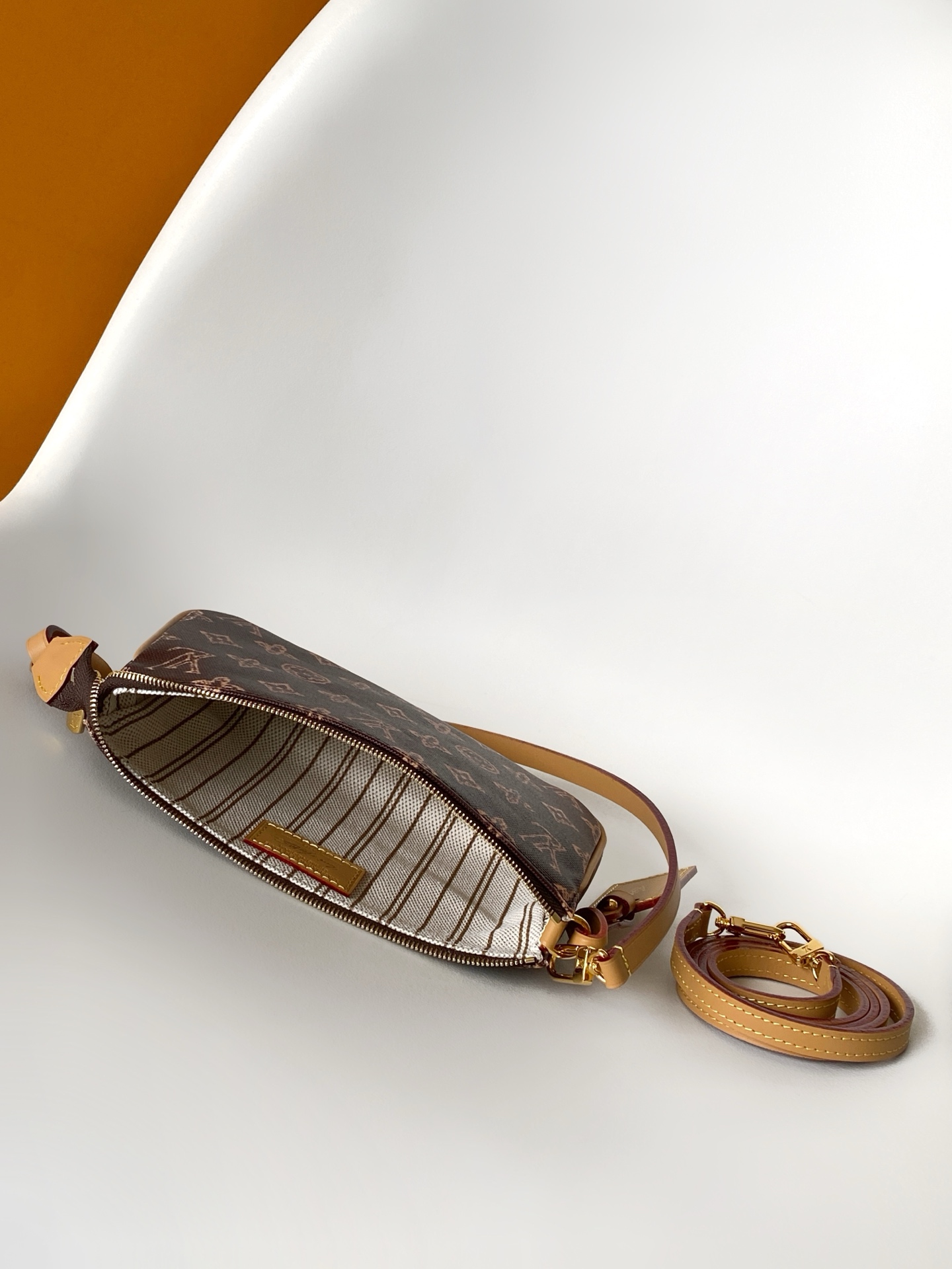 Louis Vuitton This Pochette Accessoires handbag is specially designed to celebrate the birth of the Louis Vuitton Monogram pattern.