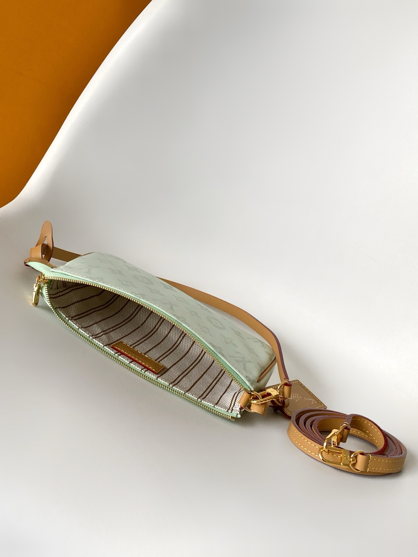 Louis Vuitton This Pochette Accessoires handbag is specially designed to celebrate the birth of the Louis Vuitton Monogram pattern.