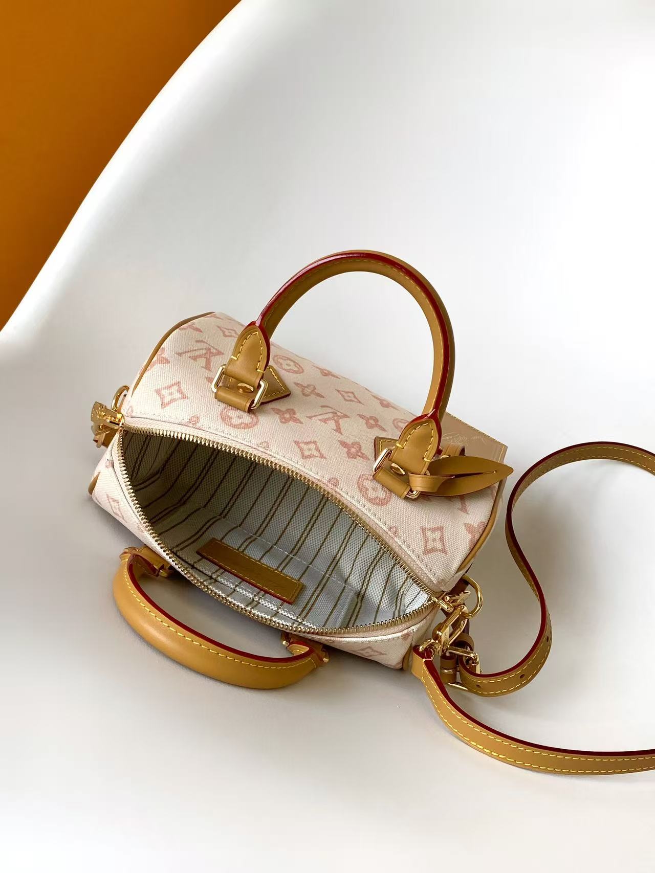 Louis VuittonThis Speedy Bandoulière 20 handbag encapsulates the design of the brand's traditional Speedy travel bag.