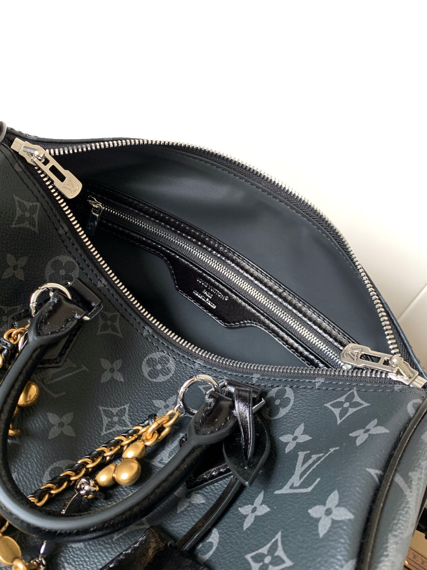 Louis Vuitton This Speedy Soft 30 handbag, part of the Ski Collection, reimagines the classic design in Monogram Eclipse canvas.