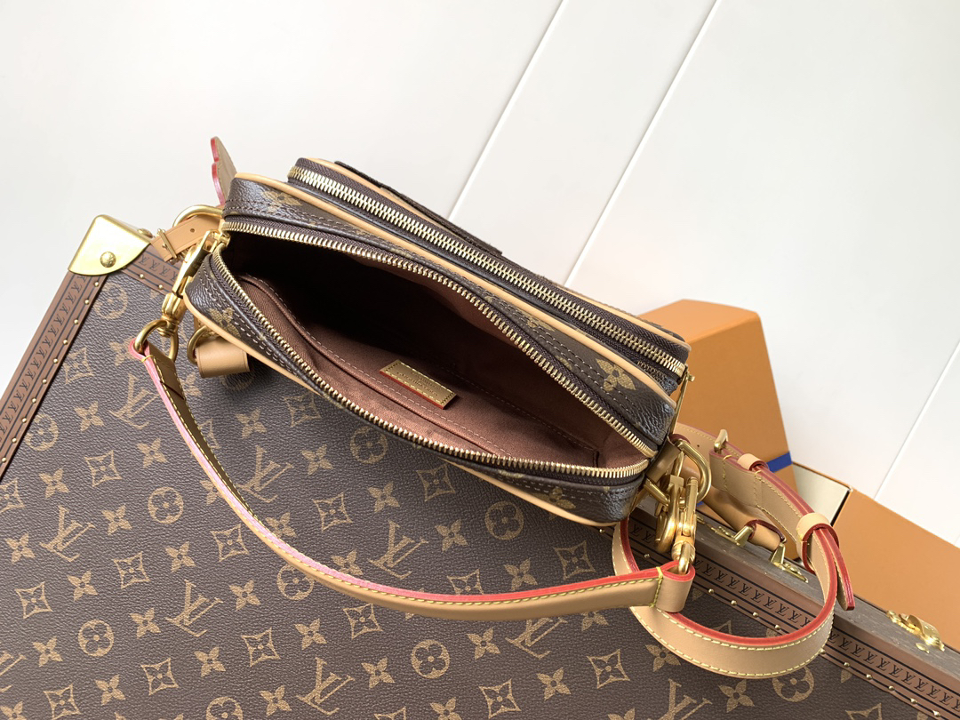 Louis Vuitton This Nil messenger bag features a Monogram canvas body accented with Damier and Monogram Reverse canvas patches, creating an elegant patchwork effect.