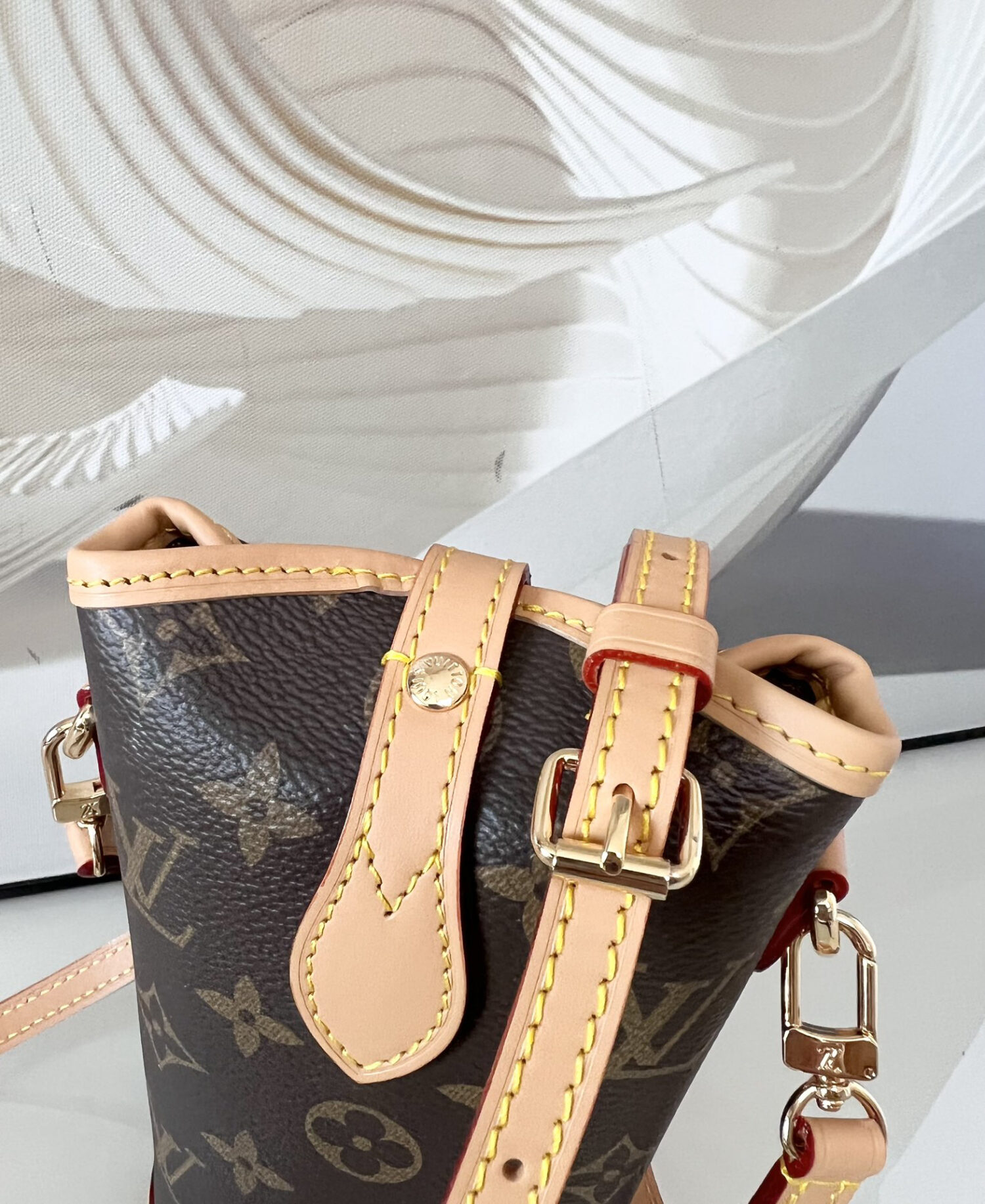 Louis Vuitton Mini Ice Cream Cone Bag — New "Fold Me" Mini Model, featuring a magnetic button closure design.