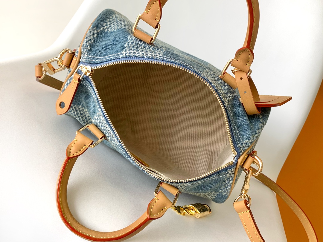 Louis Vuitton The new FW Denim Speedy 25 handbag—whether worn crossbody...
