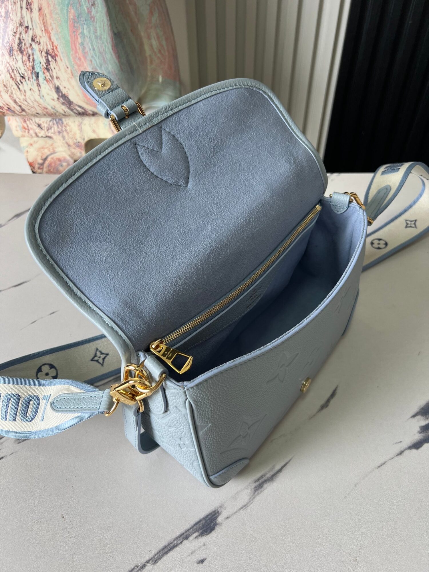 Louis Vuitton This Diane handbag infuses Monogram Empreinte embossed leather with elegant tones.