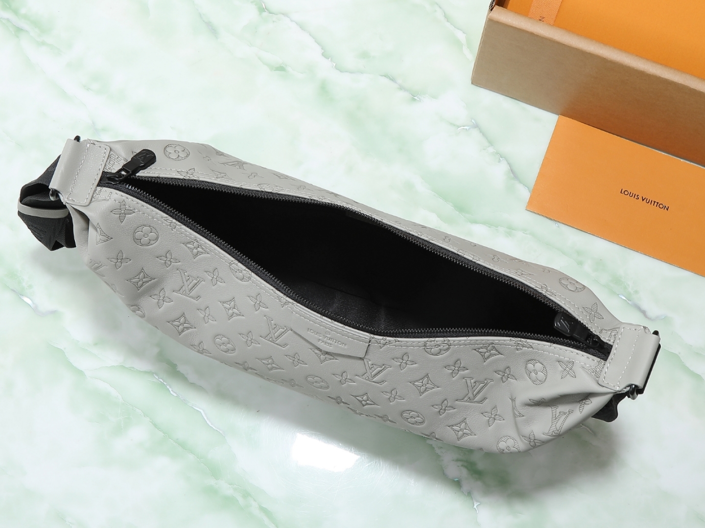 Louis Vuitton M24468: This Hobo Hamac bag is crafted from soft Monogram Shadow embossed cowhide leather.