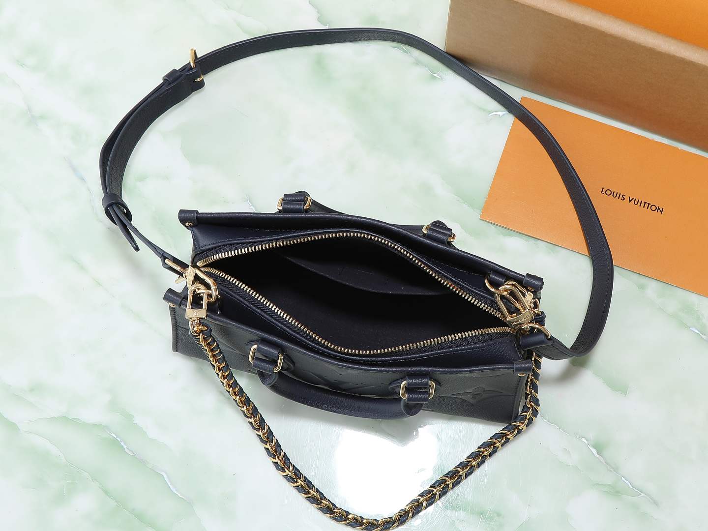 Louis Vuitton M23640 Deep Blue Embossed: This small OnTheGo handbag is crafted from Monogram Empreinte leather, embossed with the Giant Monogram pattern.